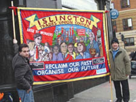 Activists display a banner sponsered by a bogus legal company to which Unite members are referred for employment disputes